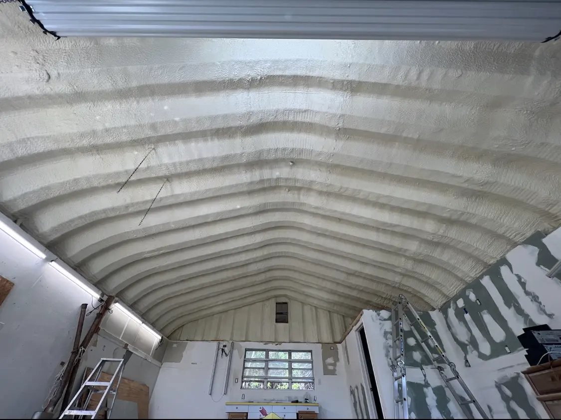 Spray polyurethane foam applied to the underside of a metal roof deck in Sturgeon Bay